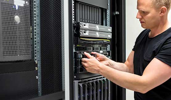 Technician installing hard drive