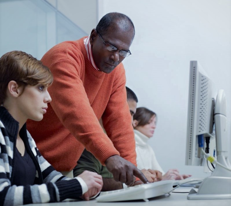 A Man helping on Computer